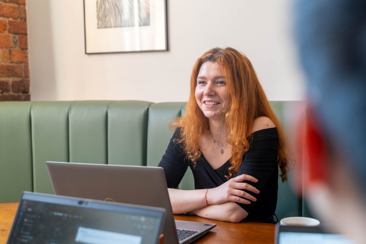 Daniela sat in the meeting room
